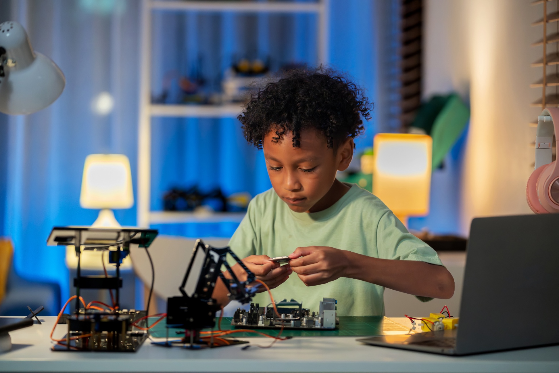 Student working on robotics at a computer