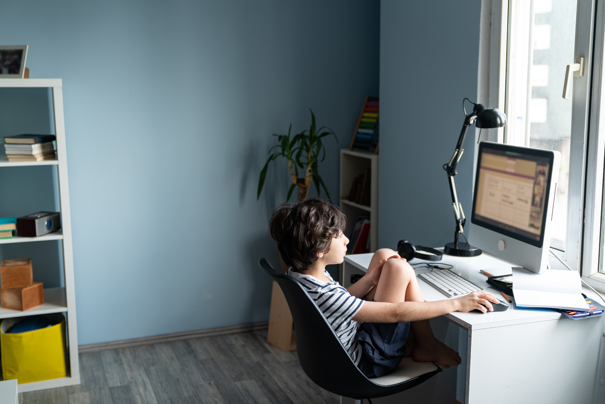 Student sitting at a computer at a desk